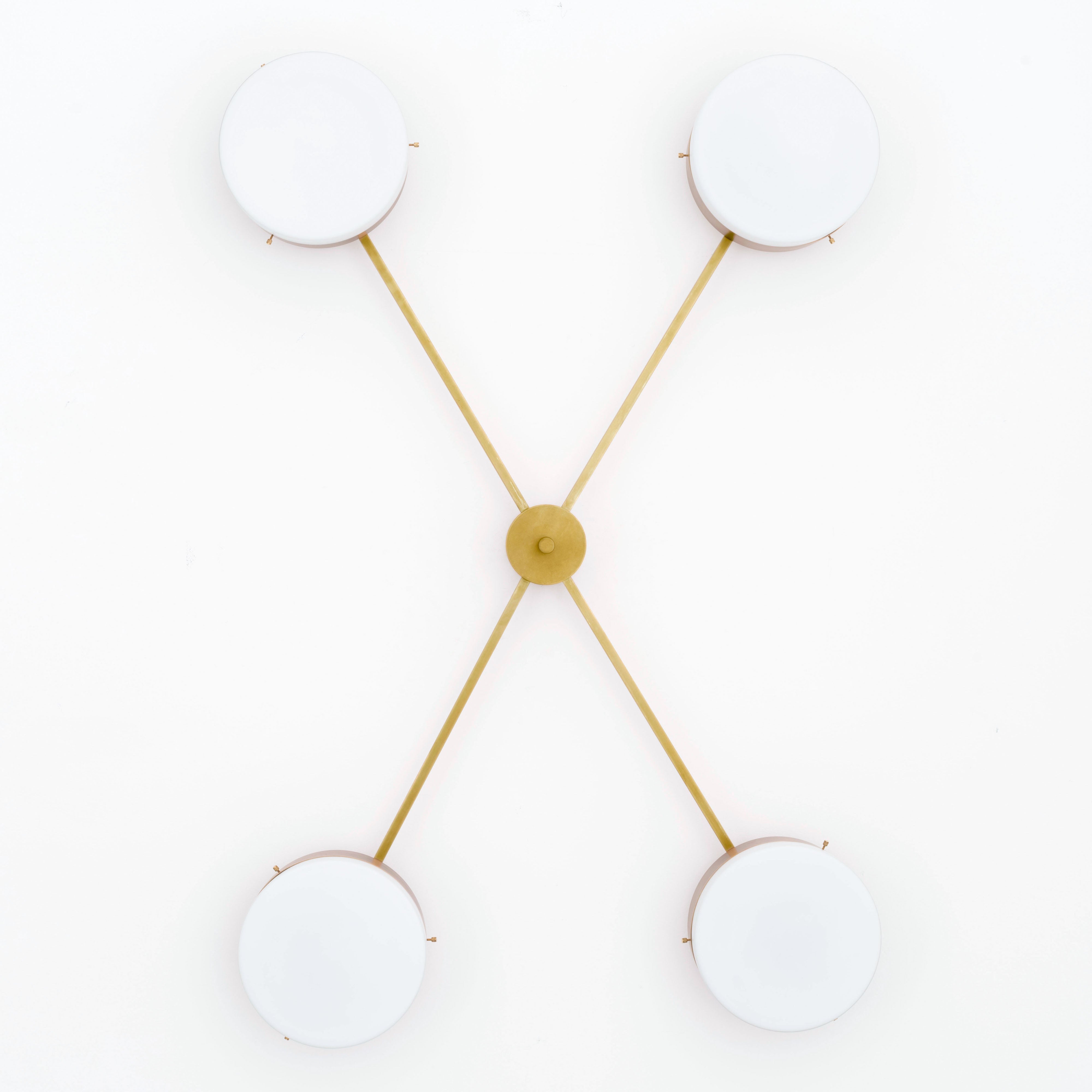 Aurora, one of the pieces in the Celeste collection, is entirely handmade. The combination of minimalist shapes, captivating geometries and excellent materials creates the strong personality of this lamp. Thanks to its 4 opaline Murano glass globes supported by 4 brass arms, it stands out in the interior environment it is placed in. Aurora can be mounted both as a hanging and a wall lamp.