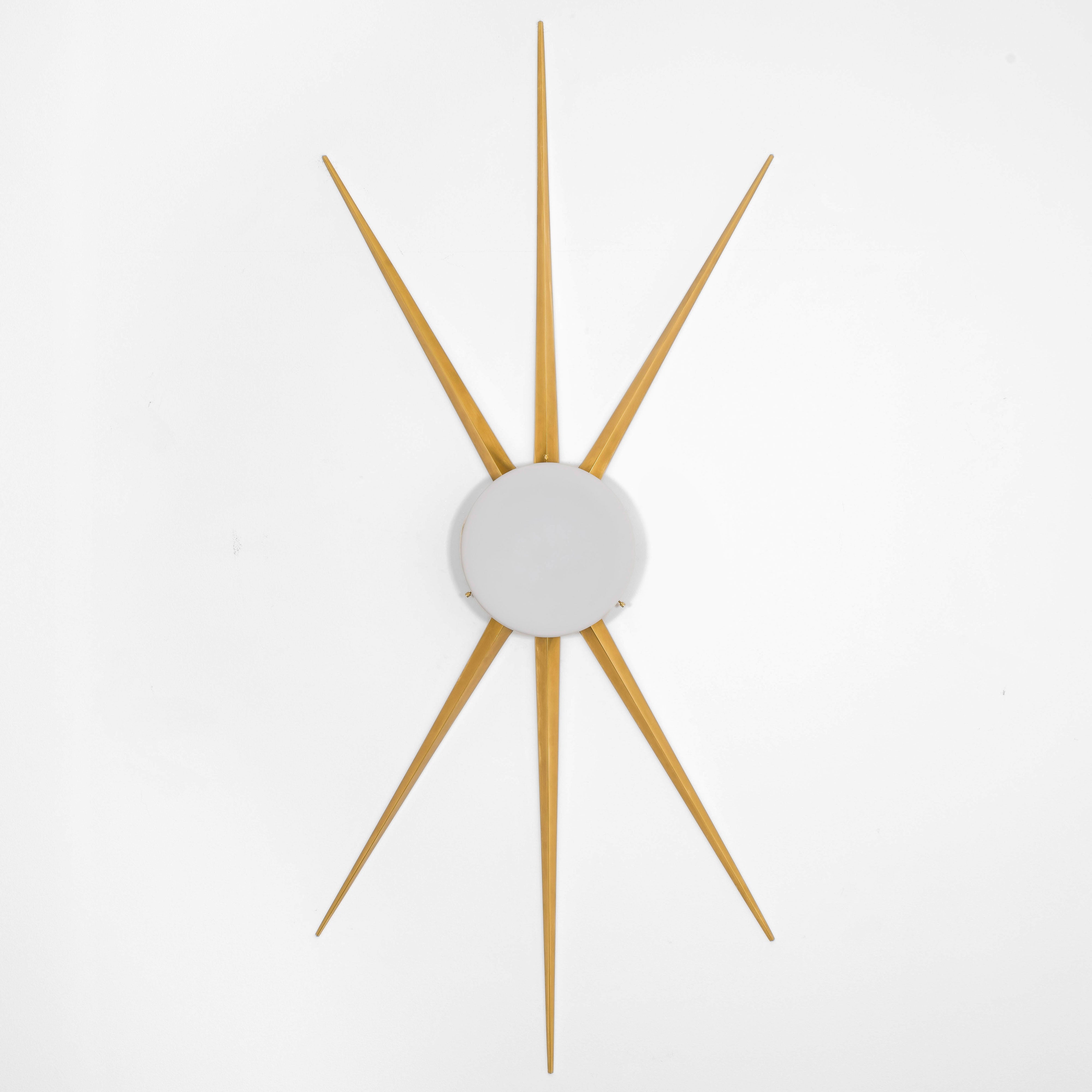 6 brass rays that radiate from an opaline Murano glass core. A tribute to the Sun, to Italian-made products and to the excellent Italian craftsmanship. Classic, like all the pieces in our collections, is handmade by our craftsmen, guided by an obsession for detail and the search for perfection.