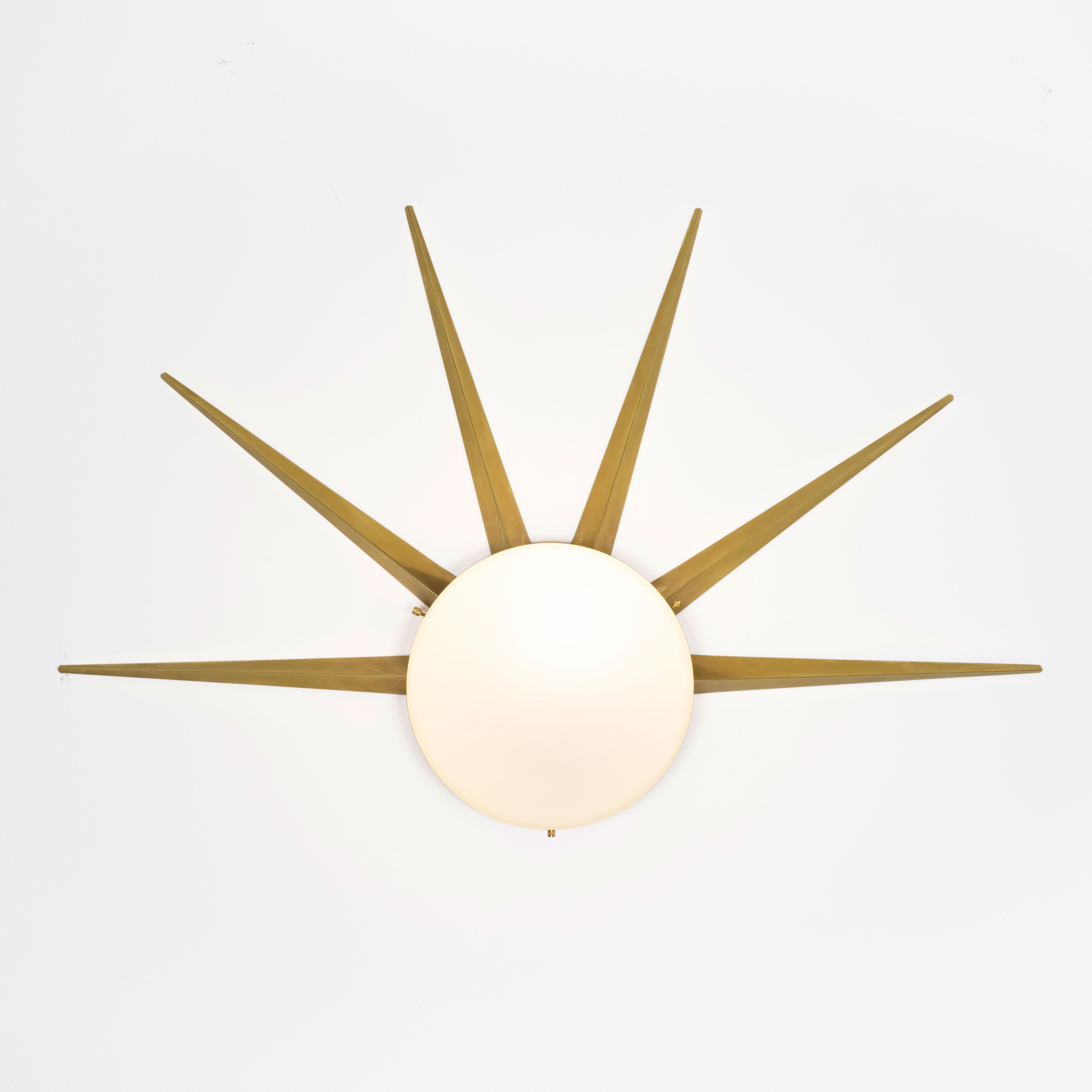 6 brass rays that radiate from an opaline Murano glass core. A tribute to the Sun, to Italian-made products and to the excellent Italian craftsmanship. Dawn, like all the pieces in our collections, is handmade by our craftsmen, guided by an obsession for detail and the search for perfection.