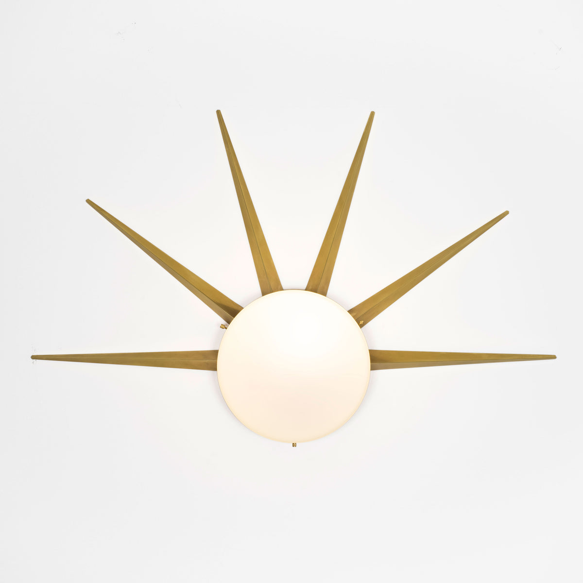 6 brass rays that radiate from an opaline Murano glass core. A tribute to the Sun, to Italian-made products and to the excellent Italian craftsmanship. Dawn, like all the pieces in our collections, is handmade by our craftsmen, guided by an obsession for detail and the search for perfection.