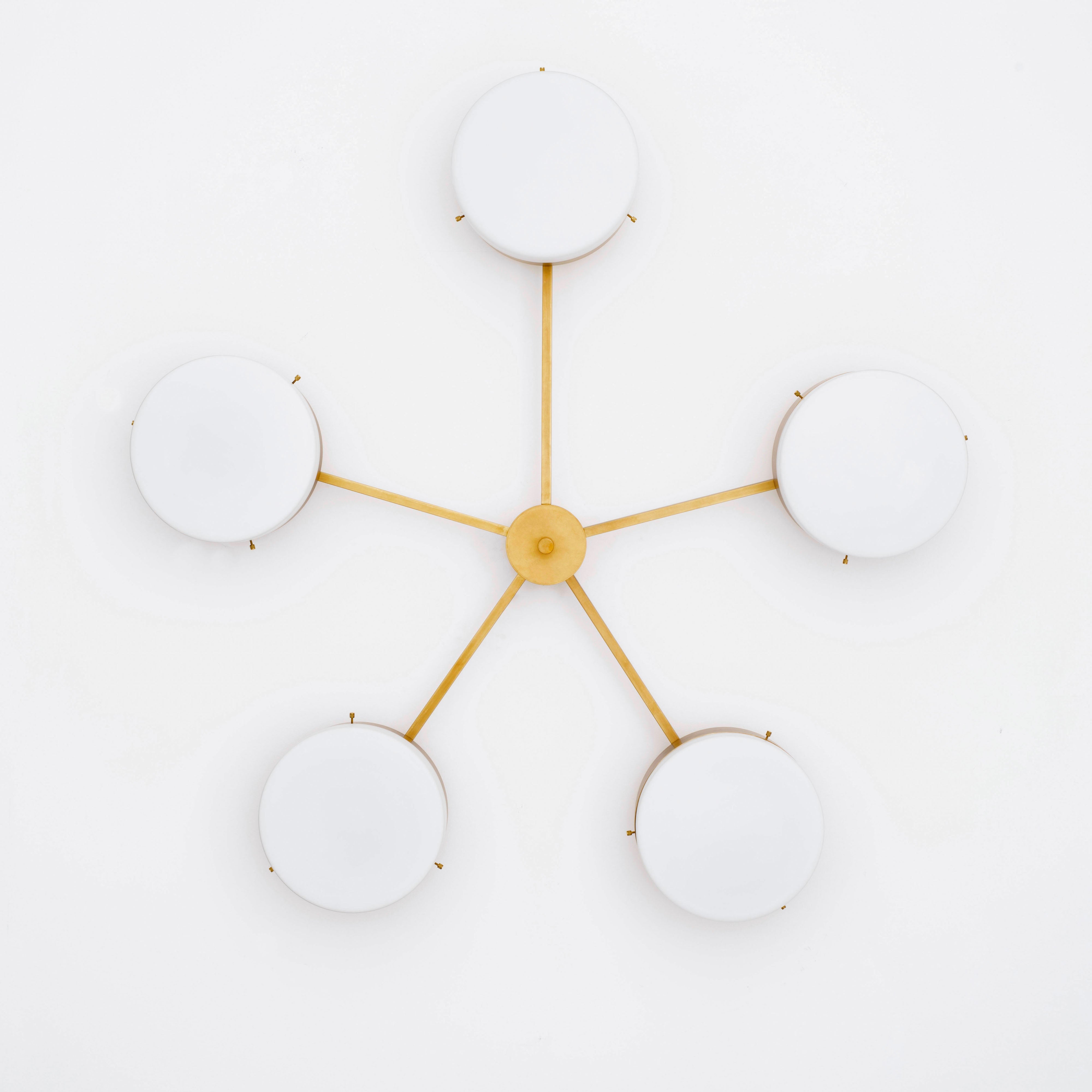 Ethereal, one of the pieces in the Celeste collection, is entirely handmade. The combination of minimalist shapes, captivating geometries and excellent materials creates the strong personality of this lamp. Thanks to its 5 opaline Murano glass globes supported by 5 brass arms, it stands out in the interior environment it is placed in. Ethereal can be mounted both as a hanging and a wall lamp.