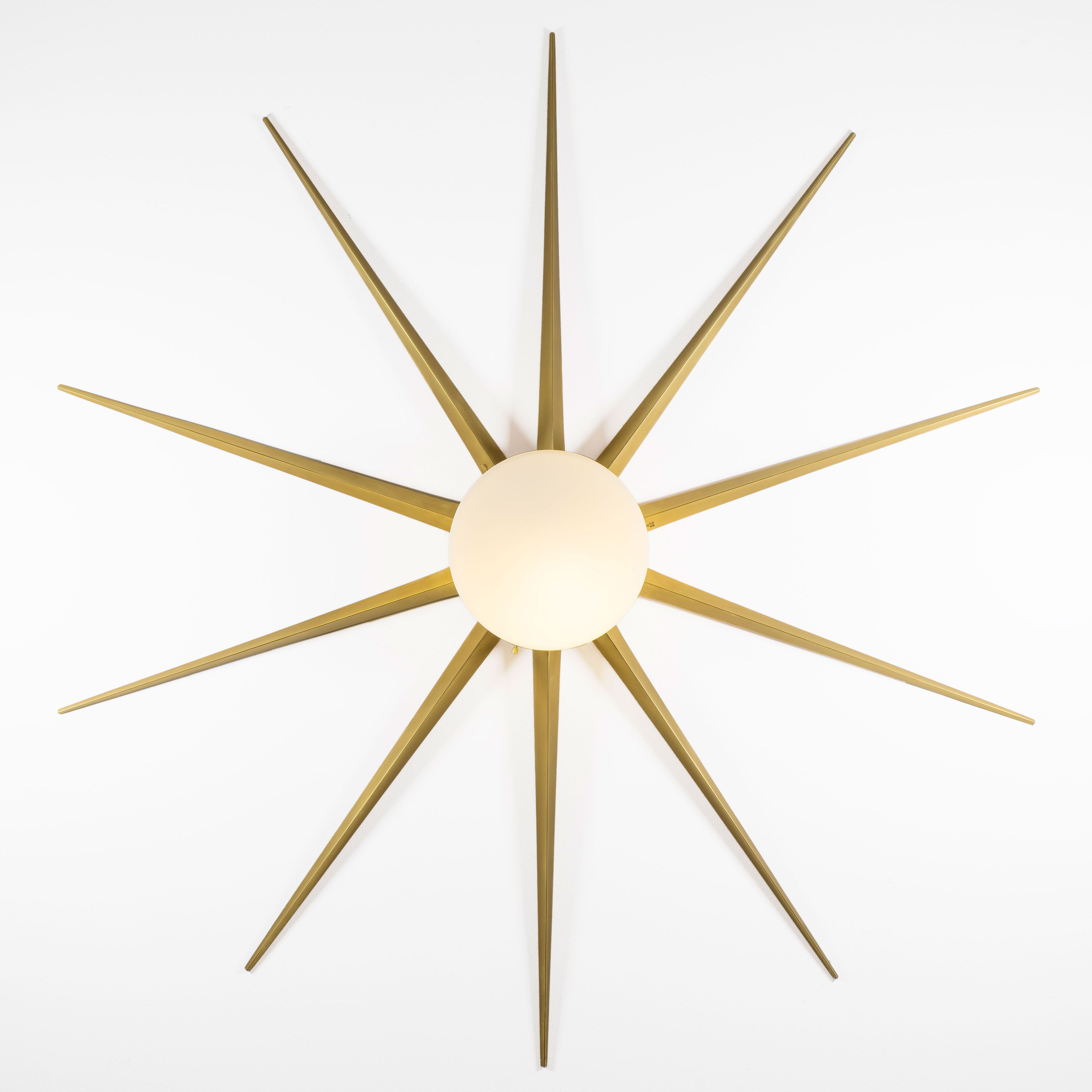 10 brass rays that radiate from an opaline Murano glass core. A tribute to the Sun, to Italian-made products and to the excellent Italian craftsmanship. Fireworks, like all the pieces in our collections, is handmade by our craftsmen, guided by an obsession for detail and the search for perfection.