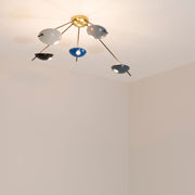 Quinque I, with its elements and its shapes simplicity and with its light and shadow effects, represents a tribute to sundials, ancient solar clocks. From a brass core, 5 thin arms branch off, lightly supporting 5 painted brass plates. Quinque I becomes a point of light and color in any home interiors, an element of creative and colored decoration.