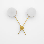 Serendipity, one of the pieces in the Celeste collection, is entirely handmade. The combination of minimalist shapes, captivating geometries and excellent materials creates the strong personality of this lamp. Thanks to its 2 opaline Murano glass globes supported by 2 brass arms, it stands out in the interior environment it is placed in. Serendipity can be mounted both as a hanging and a wall lamp.