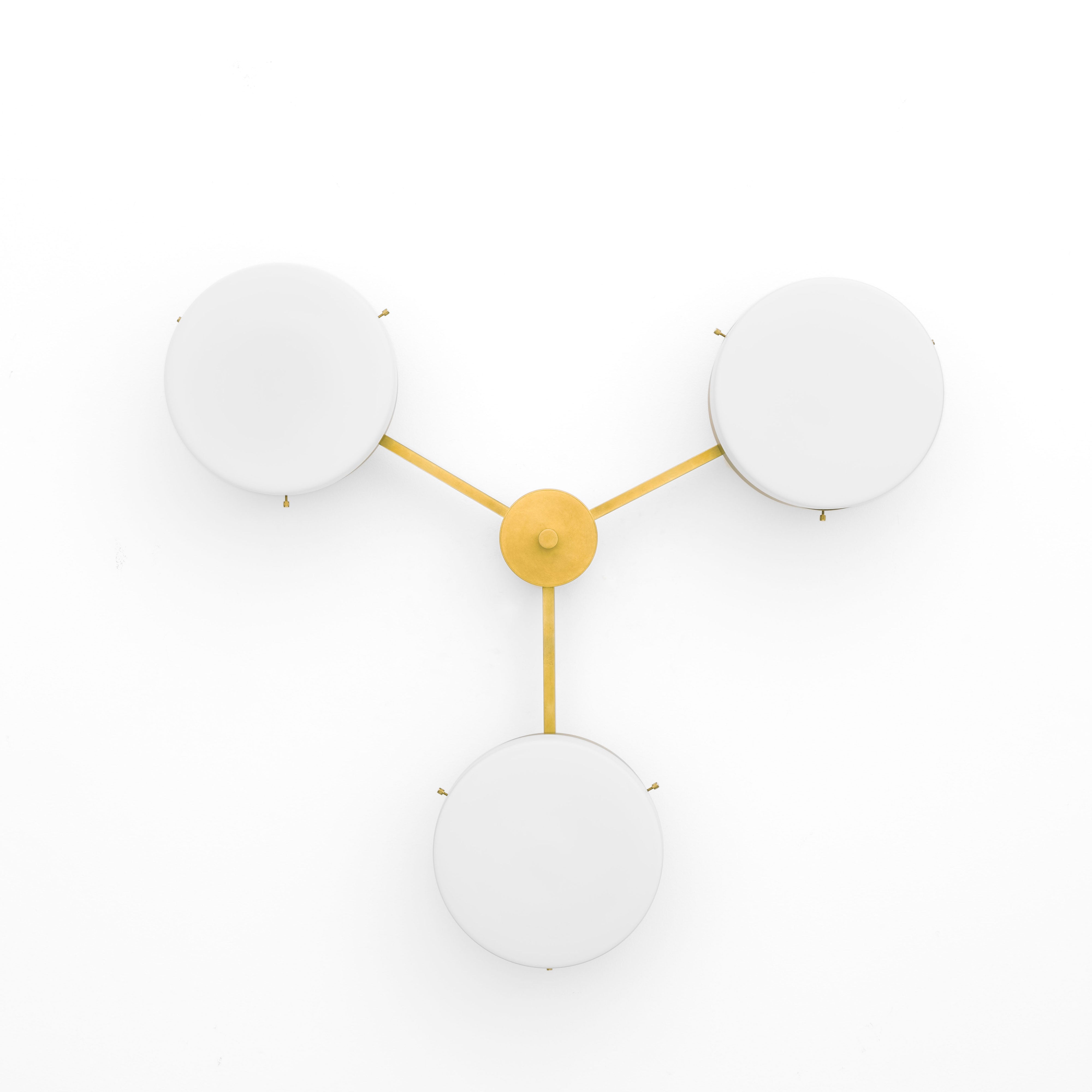 Epiphany, one of the pieces in the Celeste collection, is entirely handmade. The combination of minimalist shapes, captivating geometries and excellent materials creates the strong personality of this lamp. Thanks to its 3 opaline Murano glass globes supported by 3 brass arms, it stands out in the interior environment it is placed in. Epiphany can be mounted both as a hanging and a wall lamp.