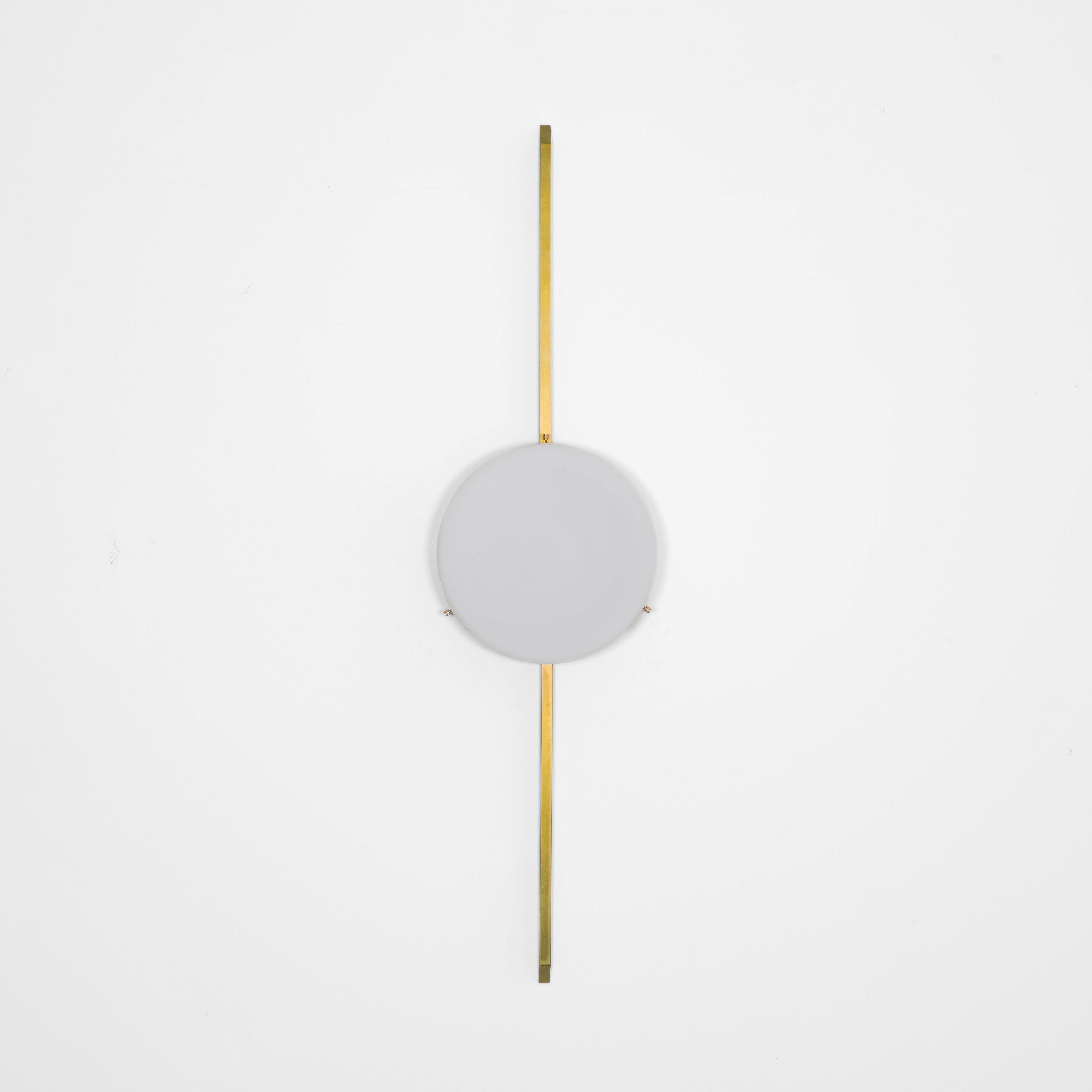 Solitude, one of the pieces in the Celeste collection, is entirely handmade. The combination of minimalist shapes, captivating geometries and excellent materials creates the strong personality of this lamp. Thanks to its opaline Murano glass globe supported by one brass arm, it stands out in the interior environment it is placed in. Solitude can be mounted both as a hanging and a wall lamp.