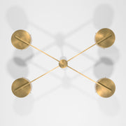 Supine, one of the pieces in the Celeste collection, is entirely handmade. The combination of minimalist shapes, captivating geometries and excellent materials creates the strong personality of this lamp. Thanks to its 4 opaline Murano glass globes supported by 4 brass arms, it stands out in the interior environment it is placed in. Supine can be mounted both as a hanging and a wall lamp.
