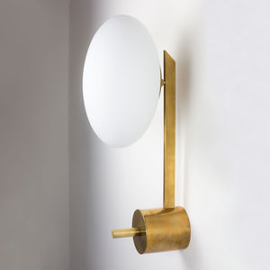  This elegant and iconic lamp in brass and opaline is inspired by mid-century Italian design. Baby is composed of an arm that supports with elegant lightness a Murano opaline glass globe. It can be mounted both as a ceiling and a wall lamp. Angelo Lelli Style