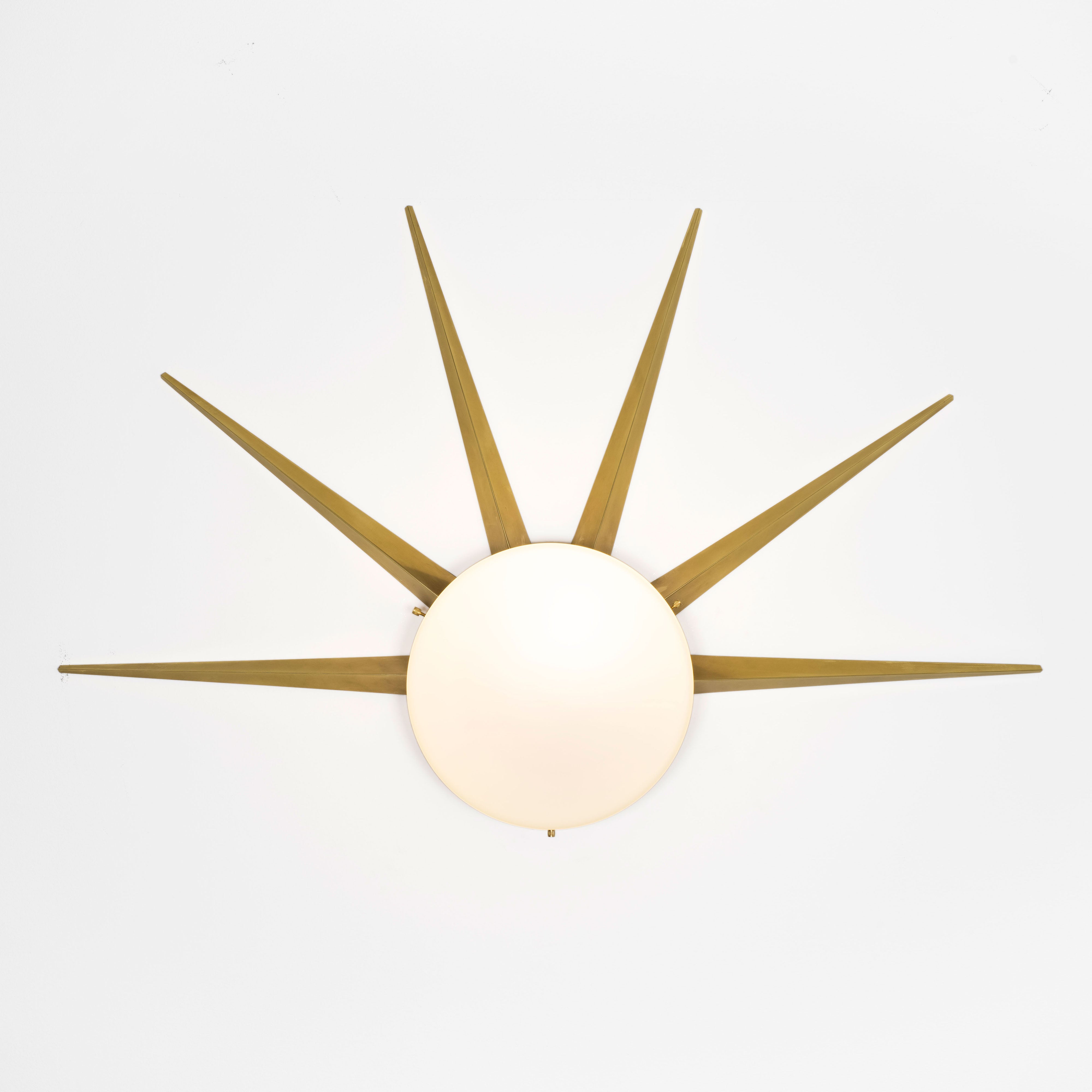  6 brass rays that radiate from an opaline Murano glass core. A tribute to the Sun, to Italian-made products and to the excellent Italian craftsmanship. Dawn, like all the pieces in our collections, is handmade by our craftsmen, guided by an obsession for detail and the search for perfection.