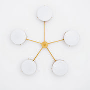 Ethereal, one of the pieces in the Celeste collection, is entirely handmade. The combination of minimalist shapes, captivating geometries and excellent materials creates the strong personality of this lamp. Thanks to its 5 opaline Murano glass globes supported by 5 brass arms, it stands out in the interior environment it is placed in. Ethereal can be mounted both as a hanging and a wall lamp.