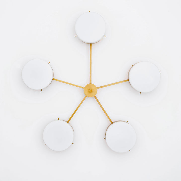 Ethereal, one of the pieces in the Celeste collection, is entirely handmade. The combination of minimalist shapes, captivating geometries and excellent materials creates the strong personality of this lamp. Thanks to its 5 opaline Murano glass globes supported by 5 brass arms, it stands out in the interior environment it is placed in. Ethereal can be mounted both as a hanging and a wall lamp.