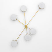 Effervesence, one of the pieces in the Celeste collection, is entirely handmade. The combination of minimalist shapes, captivating geometries and excellent materials creates the strong personality of this lamp. Thanks to its 6 opaline Murano glass globes supported by 6 brass arms, it stands out in the interior environment it is placed in. Effervesence can be mounted both as a hanging and a wall lamp. 