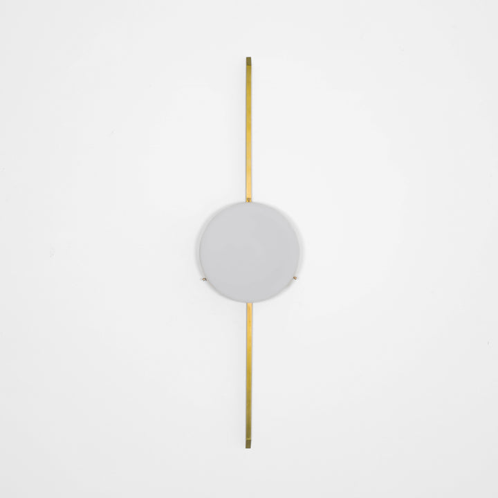 Solitude, one of the pieces in the Celeste collection, is entirely handmade. The combination of minimalist shapes, captivating geometries and excellent materials creates the strong personality of this lamp. Thanks to its opaline Murano glass globe supported by one brass arm, it stands out in the interior environment it is placed in. Solitude can be mounted both as a hanging and a wall lamp.